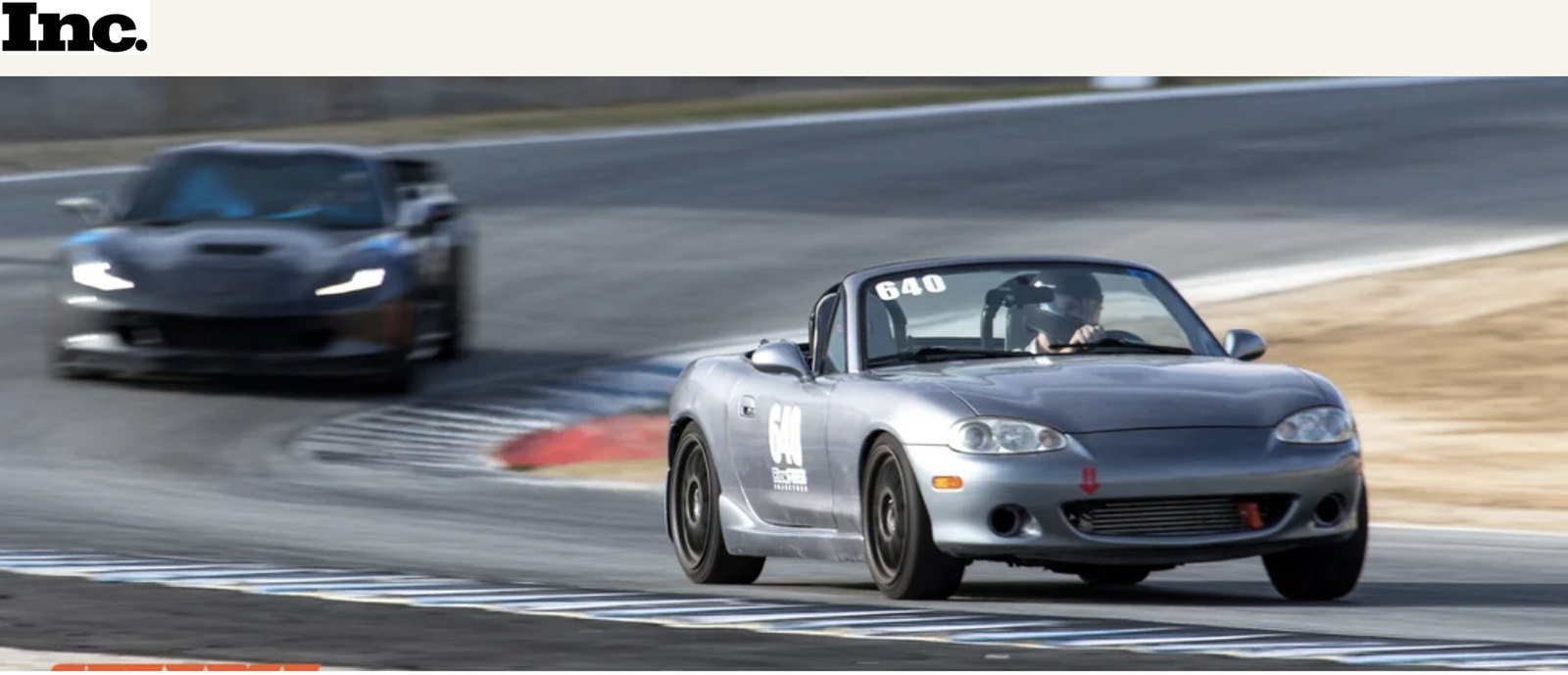 Inc. coverage of Coastline Academy, showing a silver Mazda Miata leading another car on a racetrack