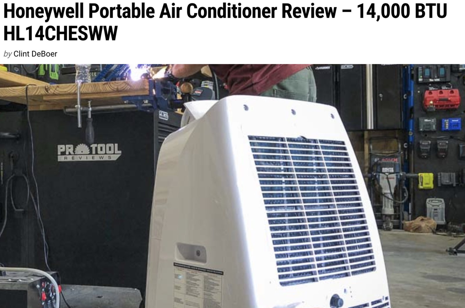 Pro Tool Reviews article headlined &ldquo;Honeywell Portable Air Conditioner Review &ndash; 14,000 BTU HL14CHESWW&rdquo;, showing the unit in a workshop